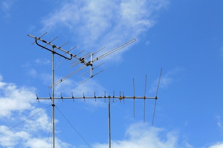 Isolated Old-fasioned Home TV Antennas with clear skyの写真素材