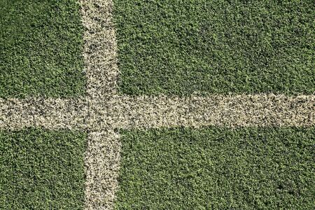 Detailed Background: old fake grass soccer field with white line の写真素材