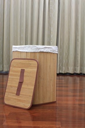 Mat basket with cover on the wooden floorの写真素材
