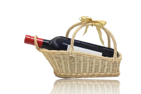 Background: isolated wine bottle with blank label on present basketの写真素材