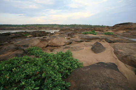 Travel background:  natural scenic of plant sand and islet near the river at Sampanbok, Grand canyon in Thailand の写真素材