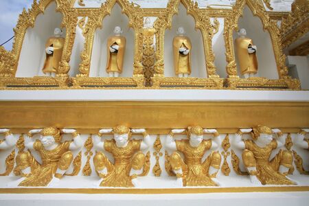 Ornament: monk and hamuman decorations attached on pagoda surface at wat Phrathat Nong Bua in Ubon Ratchathani province, Thailand の写真素材