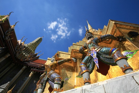 Ornament  hanuman statues attached on gold pagoda surface at Wat Phra Kaew, Thailand の写真素材
