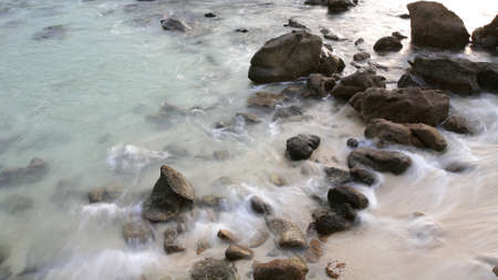 Long exposure background  rocks with misty sea  waterの写真素材