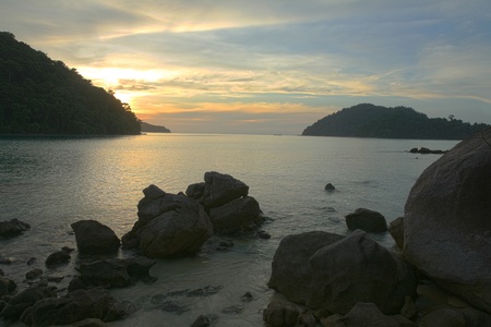 Travel background  beautiful sunset scenery at tropical beach at Surin islands national park in Phang Nga province, Thailandの写真素材