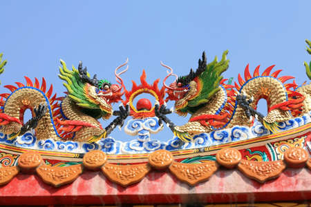 Ornament  twin dragon status on chinese temple roofの写真素材