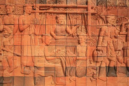 Textured background  carving decoration of ancient Thai female activity on the wallの写真素材