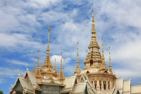 Ornament  closeup of beautiful roof architecture against blue sky and cloud at Sorapong s Temple in Nakhon Ratchasima Province, Thailand の写真素材