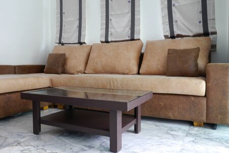 Big brown sofa and small table at living roomの写真素材