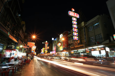 Night View of Bangkok s Chinatown at street with traffic motion, footpath restaurants, and old buildings on June 04, 2012 in Bangkok, Thailand  のeditorial素材