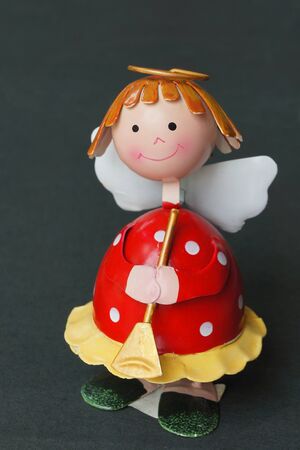 Little angel model made by chrome isolated on black backgroundの写真素材