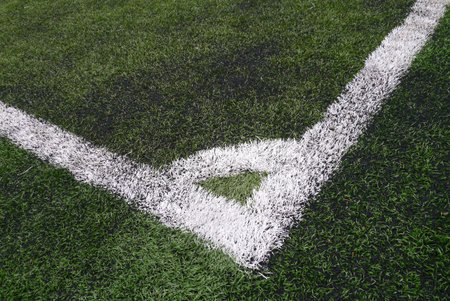 Closeup corner spot at fake grass soccer field