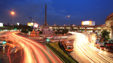BANGKOK -JUL 07  Night landscape view on the Victory Monument, the big military monument, in Bangkok on 07 July 2012  The monument has been established in June 1941 to demonstrate a victory sign in war with Frenchmenのeditorial素材