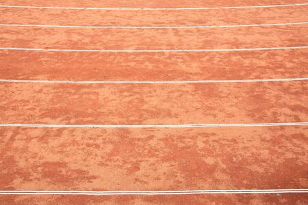 Closeup rough red running trackの写真素材