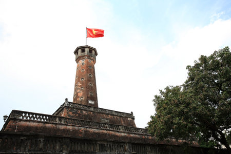 Ancient fortress with national flag in Hanoi, Vietnamのeditorial素材