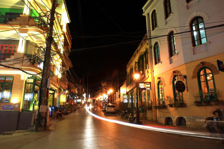 SAPA- JUL 20  Light trails on street in Sapa downtown at night on July 22, 2012 in Sapa, Vietnam  All buildings on this street are restaurants, pubs, and hotels to serve visitors all over the world のeditorial素材