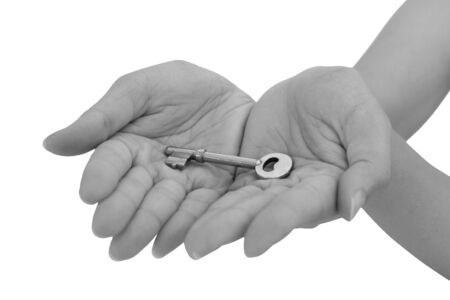 A key on hands isolated on white spaceの写真素材