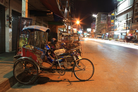 NAKHON RACHASIMA-SEP 08  Thai Tricycle bicycle parks on the urban street on September 08, 2012 in Nakhon Ratchasima downtwon, Thailand  Tricycle bicycle is used for local transit in this city  のeditorial素材
