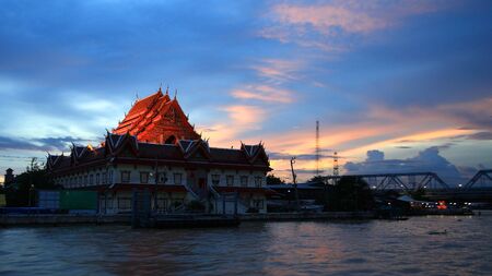 Twilight view of Thai temple near Chao Phraya river in Bangkok, Thailandの写真素材