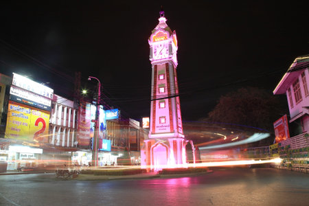 NONTHABURI-SEP 12  Light trails around clock tower on September 12, 2012 in Nonthaburi downtown,...