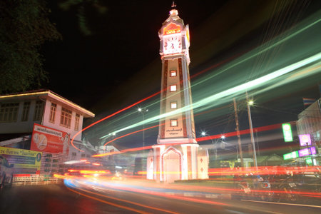 NONTHABURI-SEP 12  Light trails at clock tower on September 12, 2012 in Nonthaburi downtown, Thailand  This clock tower is located near Chao Phraya river pier, Nonthaburi museum, and street market のeditorial素材