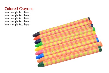 Colorful crayons isolated on white background with sample textの写真素材