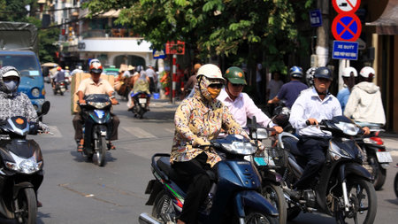 HANOI - JULY 20  Unidentified people ride motorbikes on busy road on July 20, 2012 in Hanoi, Vietnam  Motorbike is the most famous vehicle for Hanoians, so Hanoi is easily called the motorbike city  のeditorial素材