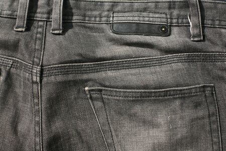 Closeup texture of back black jeans textileの写真素材