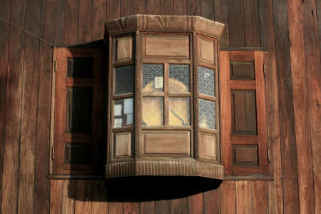 Antique wooden wall and overlapped window of traditional house in Thailandの写真素材