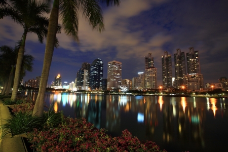 Cityscape view of modern buildings at Benjakitti garden at dusk in Bangkok, Thailand の写真素材