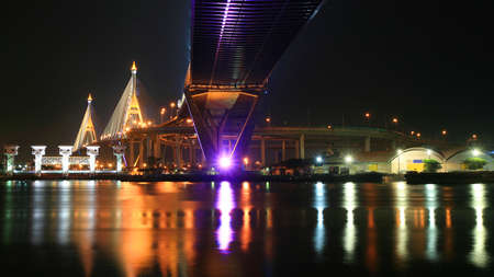 Bhumibol bridge across Chao Phraya river with colorful reflection in Bangkok, Thailand の写真素材