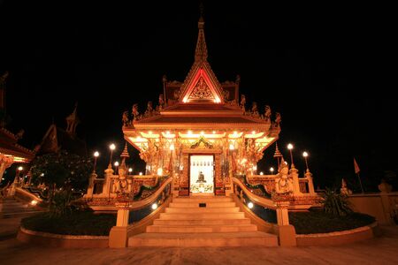Beautiful Thai temple at night of wat Liab in Ubonratchathani province, Thailandの写真素材