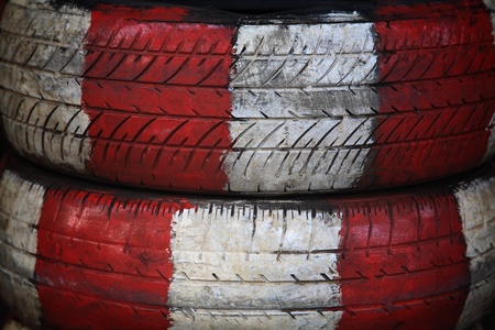 Old tire painted by red and white colorの写真素材