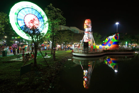 NONTHABURI-DEC 02  Ferris wheel and city hall with the reflection on yearly city hall celebration in Nonthaburi on December 02, 2012 in Nonthaburi, Thailand  This event is set on Dec 1 to 3, 2012 のeditorial素材