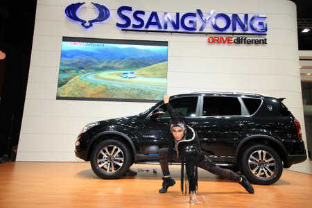 NONTHABURI-DEC 08  Ssangyong Rexton with unidentified model in the 29th Motor Expo on December 08, 2012 in Nonthaburi, Thailand  An event is settled from Nov 30 to Dec 10, 2012 at Muang Thong thani のeditorial素材