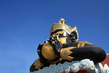 Rahu, the black Idian god eating the moonの写真素材