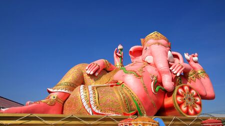 Big pink Ganesha against blue sky at wat Saman Rattanaram in Chachoengsao, Thailandの写真素材