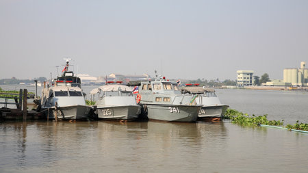 NONTHABURI-DEC 16  Small marine police ships parking on the port at Chao Phraya river on December 16, 2012 in Nonthaburi province, Thailand  Thai Marine police division is established in 1961 のeditorial素材