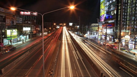 NONTHABURI-DEC 16  Light trails on the bridge and Ngamwongwan street near Shopping center at night on December 16, 2012 in Nonthaburi province, Thailand  のeditorial素材