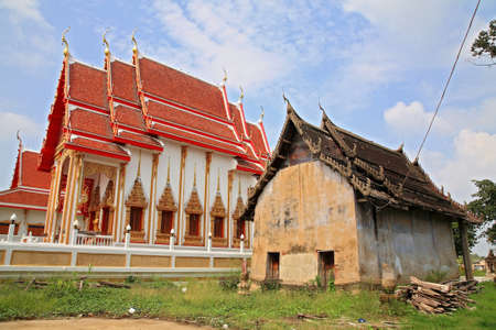Ancient and new Monastery buildings at Chalerm phrakiat temple architecture against blue sky in Pathum Thani, Thailand の写真素材