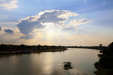Rays of sun shining through the clouds の写真素材