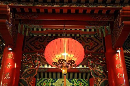 Red lamp or lantern hanging on chinese temple shoulder poleの写真素材