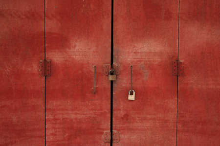 Antique red wooden door with lock