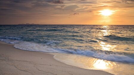 Colorful sunrise above Andaman sea with beautiful beach in Thailandの写真素材