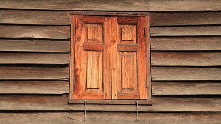 Red closed wooden windows の写真素材