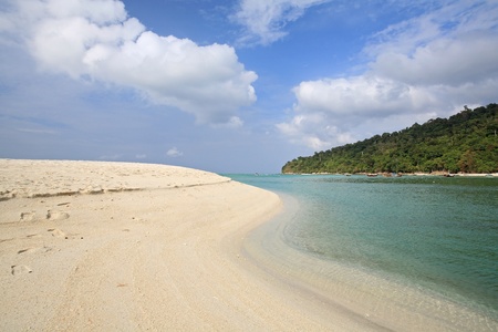 Sand shore in curve shape against blue sky at Koh Adang in Satun, Thailandの写真素材