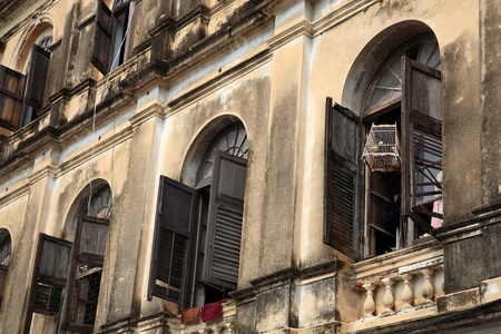 Wooden birdcage hanging at the windowの写真素材