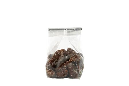 Tamarind with sugar inside plastic package isolated on white backgroundの写真素材