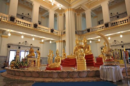 Golden Buddha statues inside temple of Wat Sothon Wararam Worawihan, the landmark of Chachoengsao province, Thailandの写真素材