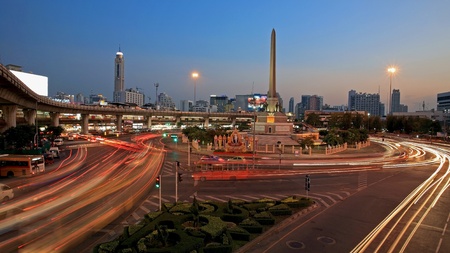 BANGKOK-April 19  Light trails on street at Military victory monument at twilight on April 19, 2013 in Bangkok, Thailand  Monument built in June 1941 to demonstrate a victory sign of war with France  の写真素材